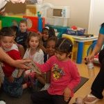 reptile zoo experience at daycare with teachers and class